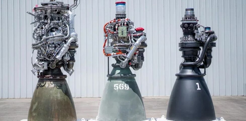 Photograph of three versions of the raptor engine, each one getting progressively simplified in mechanical parts.