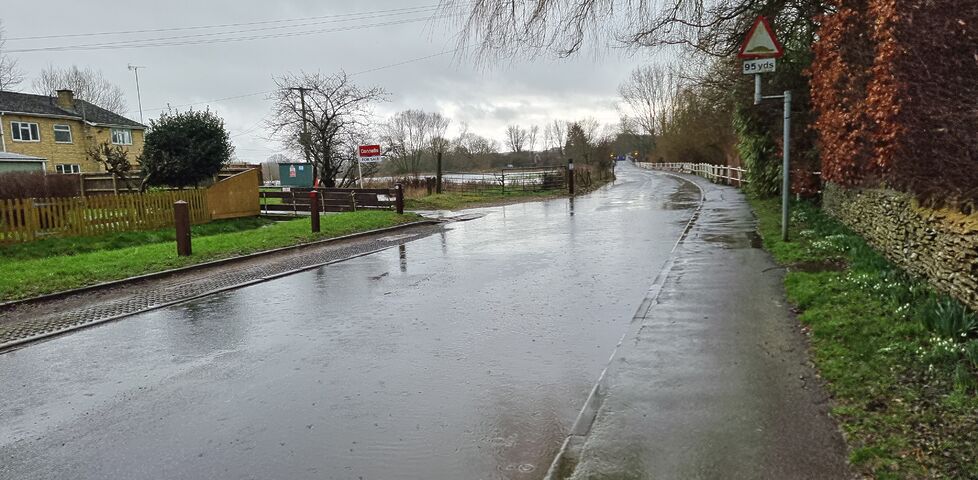 A flooded rural road.