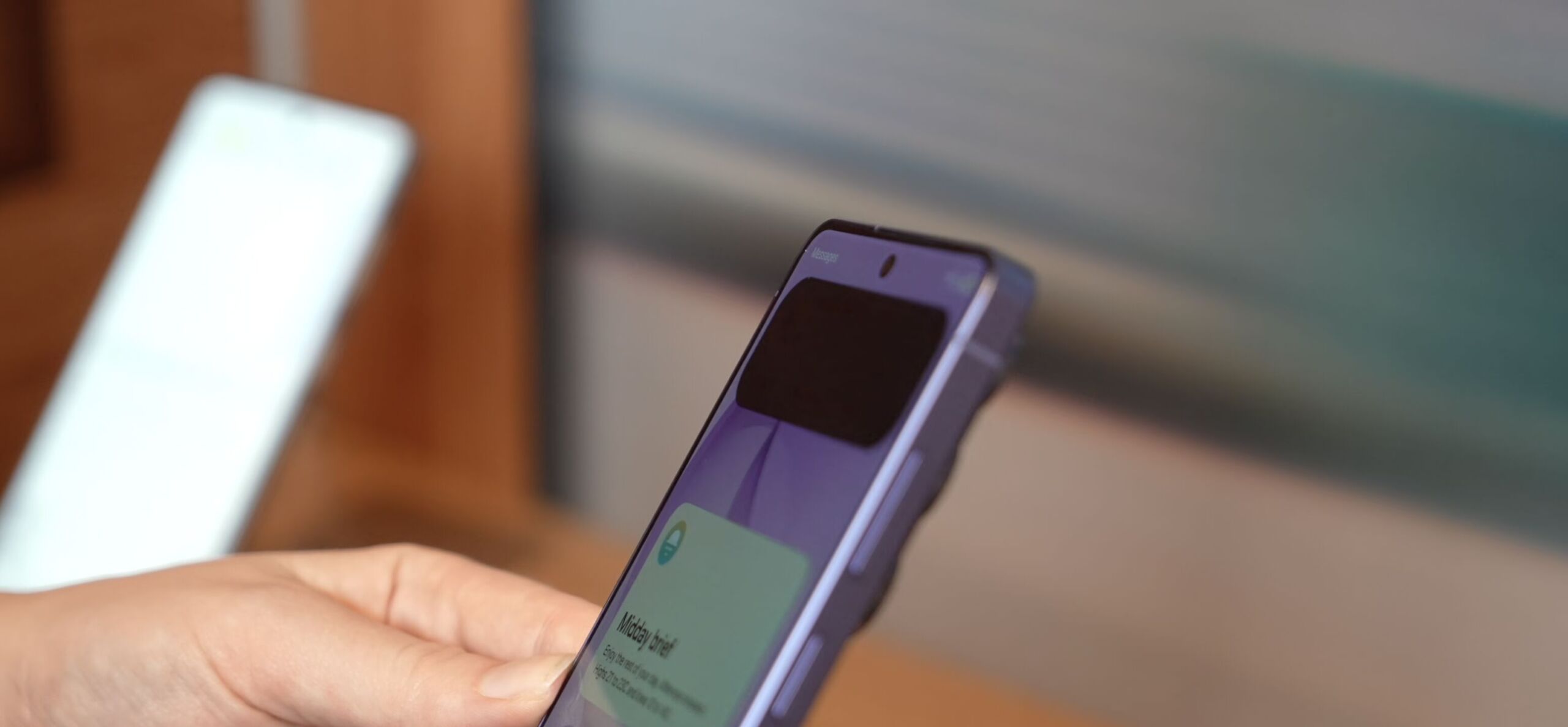 Full image of Photo showing a pre-release Samsung Galaxy S26 handset, viewed from sideways on. Most of the screen is visible, but a new notification is 'blacked out' and only visible to somebody viewing the screen from straight-on.