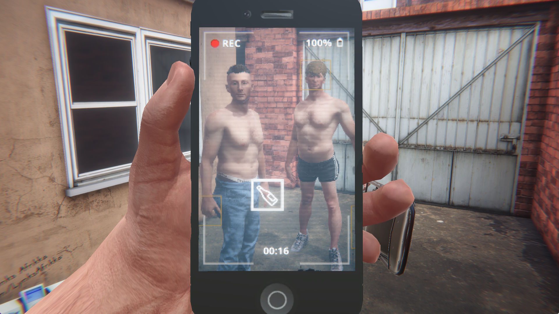 Full image of Screenshot from Hard Lads. Through the screen of a phone camera recording a video, we see two partially-dressed young men in the yard of a terraced house, alongside a folding chair.