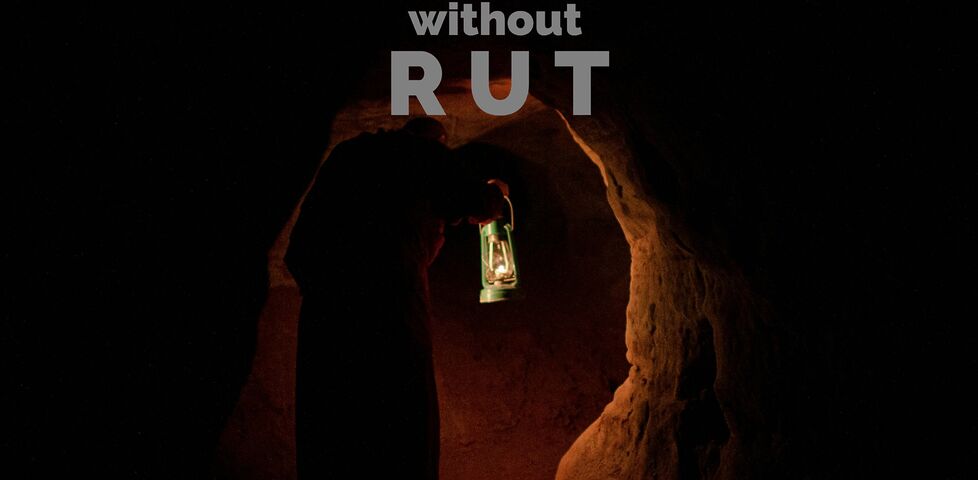 A man in a dark tunnel, captioned "you can't spell ROUTINE without R U T".