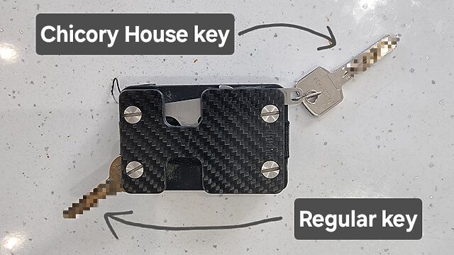 Reverse side of my wallet showing my regular house key folded-out from its special spot, and the Chicory House key attached to the hook.