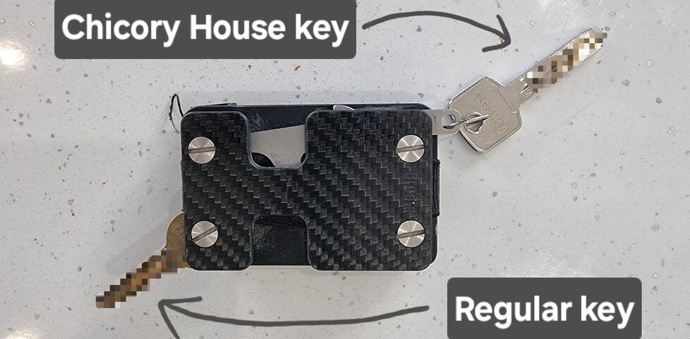 Reverse side of my wallet showing my regular house key folded-out from its special spot, and the Chicory House key attached to the hook.