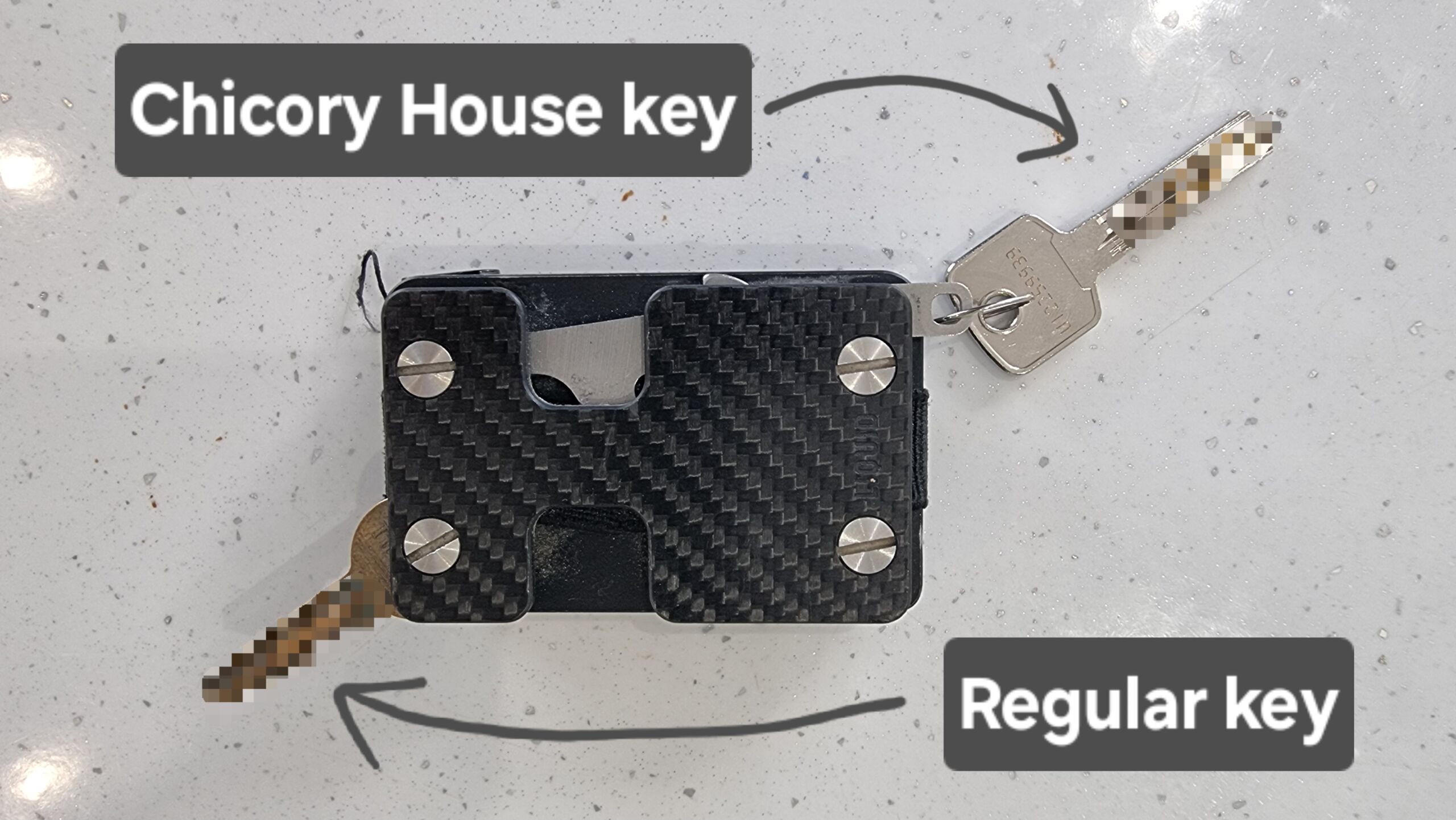 Full image of Reverse side of my wallet showing my regular house key folded-out from its special spot, and the Chicory House key attached to the hook.