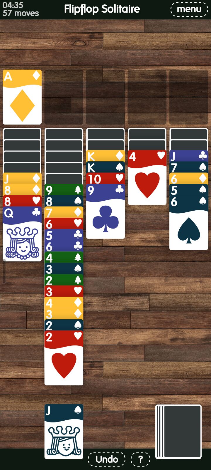Full image of A late game on 5-suit FlipFlop solitaire with many mixed-suit stacks and many face-down cards.