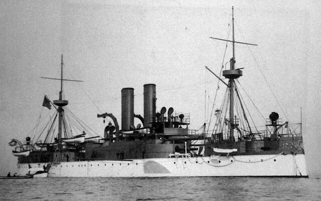 Cruiser with two funnels, seen from starboard side.