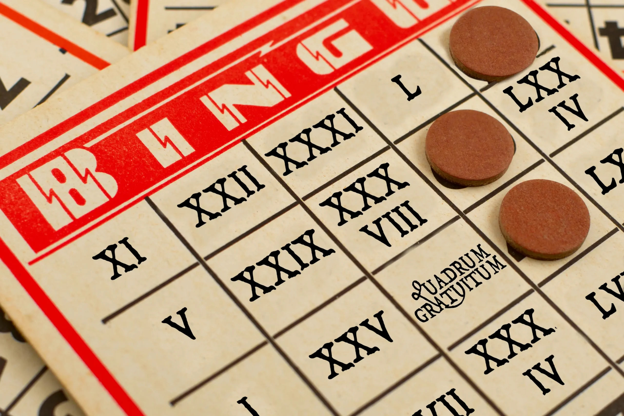 Full image of An American-style bingo card with Roman numerals in place of the numbers and 'quadrum gratuitum' in place of the free space. Based on an original photo by Oeil De Vautour / Edwin Torres, used under a Creative Commons Attribution 2.0 Generic license.