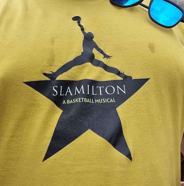 Close up of a t-shirt in the style of a Hamilton one but for Slamilton: A Basketball Musical.