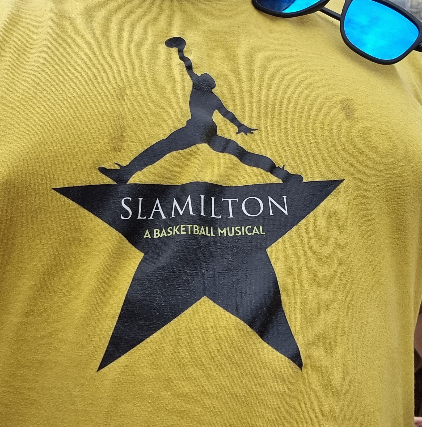 Full image of Close up of a t-shirt in the style of a Hamilton one but for Slamilton: A Basketball Musical.