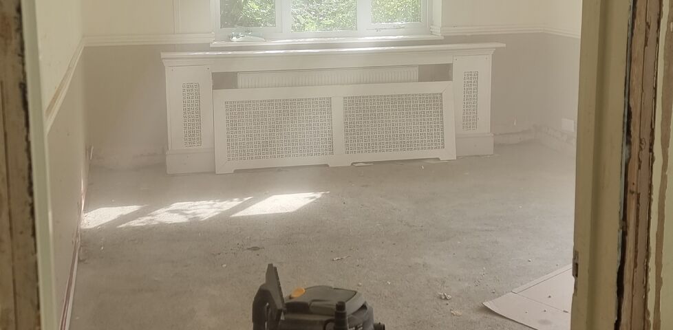 A sparse room caked in a cloud of dust.