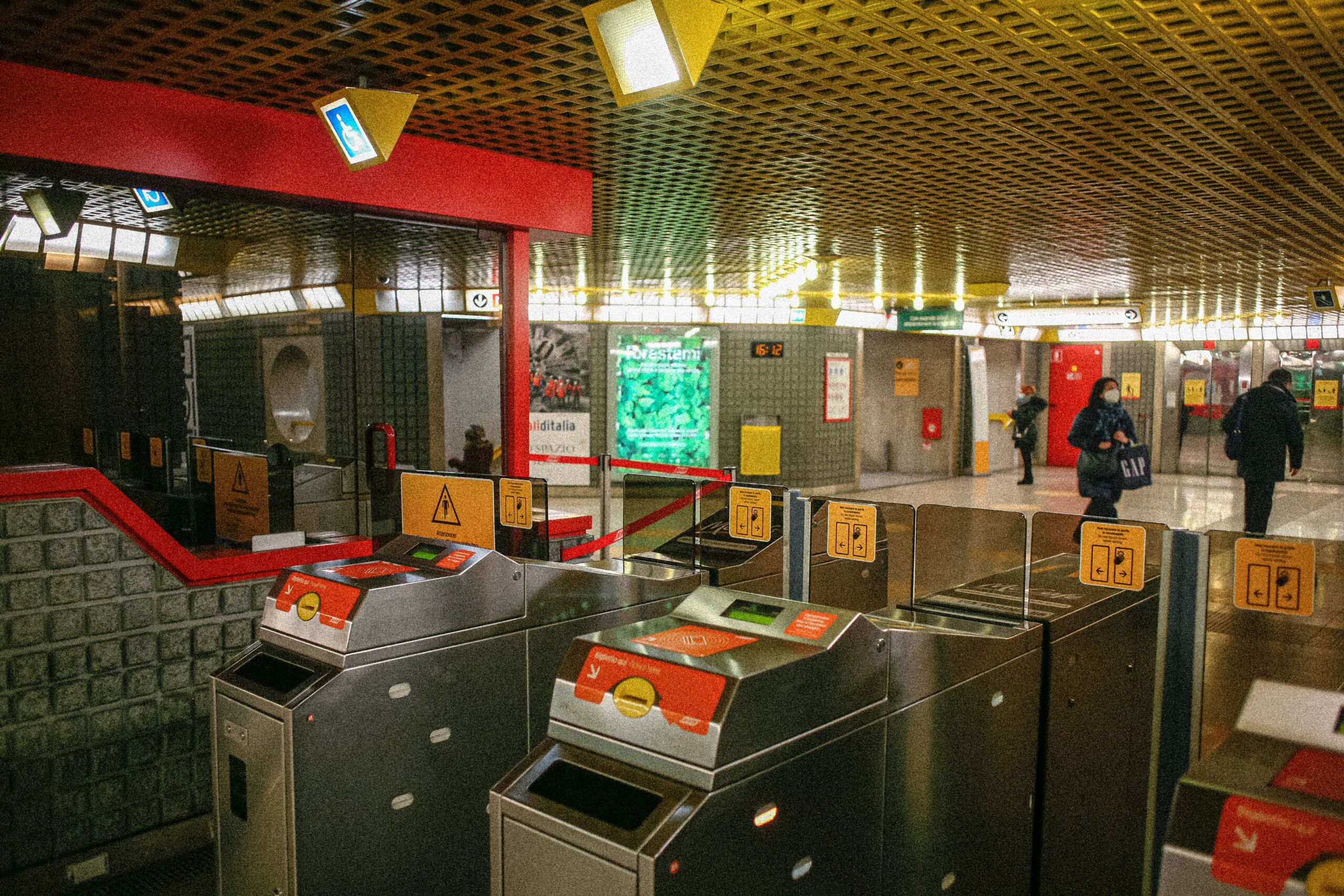 Full image of A row of ticket gates in a London Underground station.