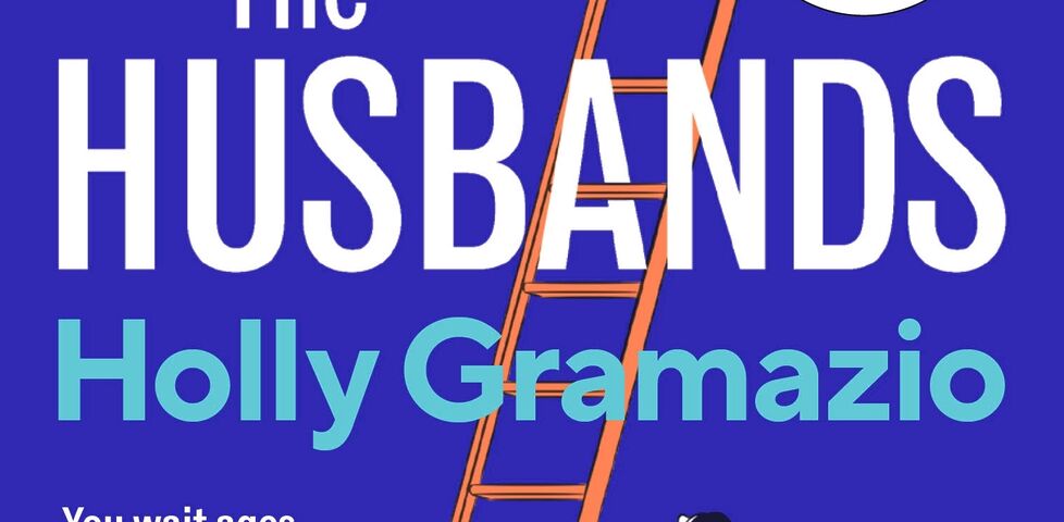 Cover of The Husbands by Holly Gramazio, with tagline 'you wait ages for The One... then 203 come along at once'. Five-colour poster art shows a woman wearing a sleeveless top, long skirt, and trainers using a hand saw to cut through a ladder which stretches up through the title and at the top of which we can just make out the trousered legs of a man, climbing past a pendant light.