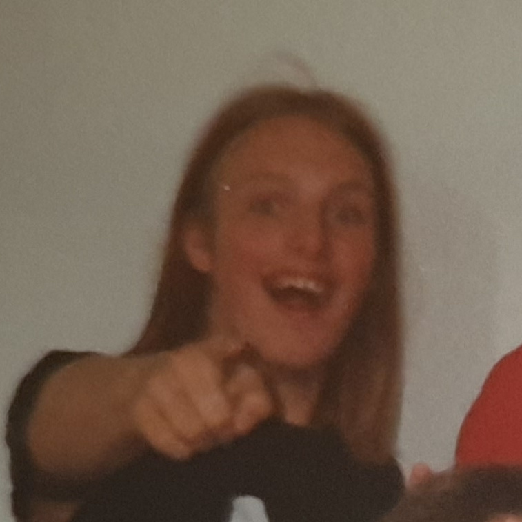 Full image of Low-resolution crop showing Dan, aged around 17, laughing and pointing at the camera.