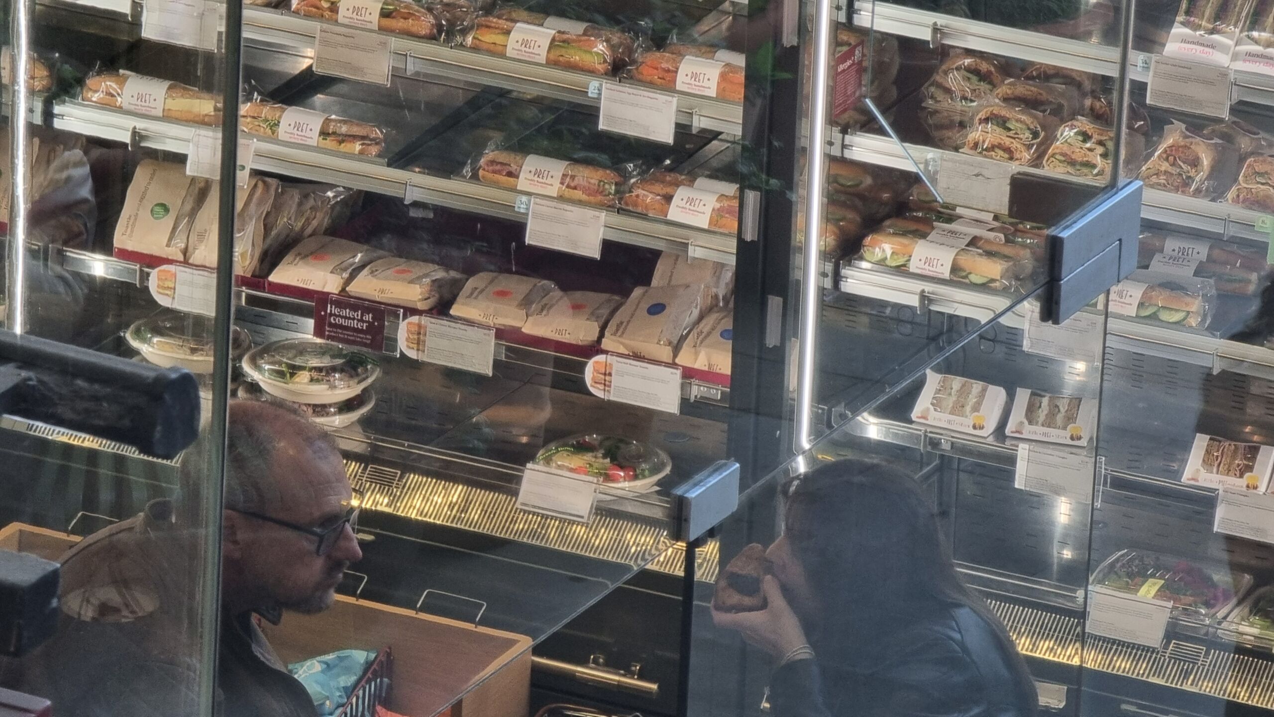 Full image of View through the window of a Pret cafe.