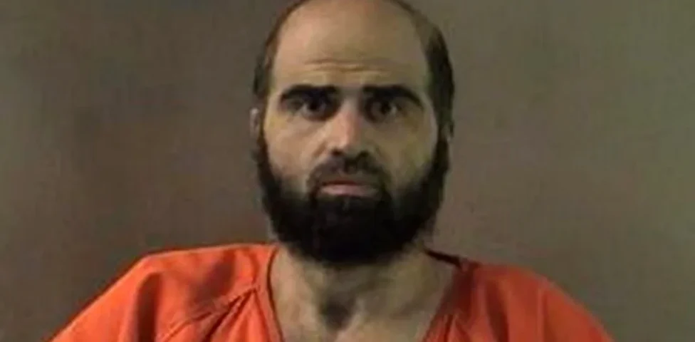 An undated handout image of Hasan that was released by authorities in 2012