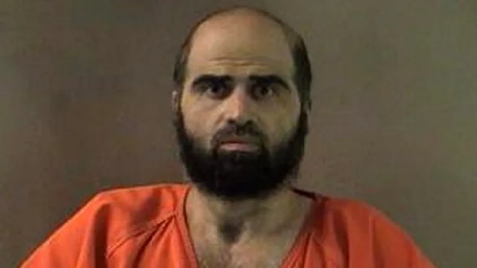 Full image of An undated handout image of Hasan that was released by authorities in 2012