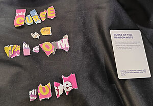 'Curse of the ransom note', spelled out line a ransom note and with its card alongside.